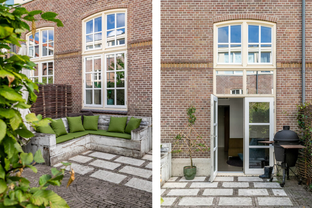 Brick patio with green cushions and open door.