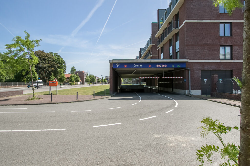 Entrance to underground parking garage in cityscape
