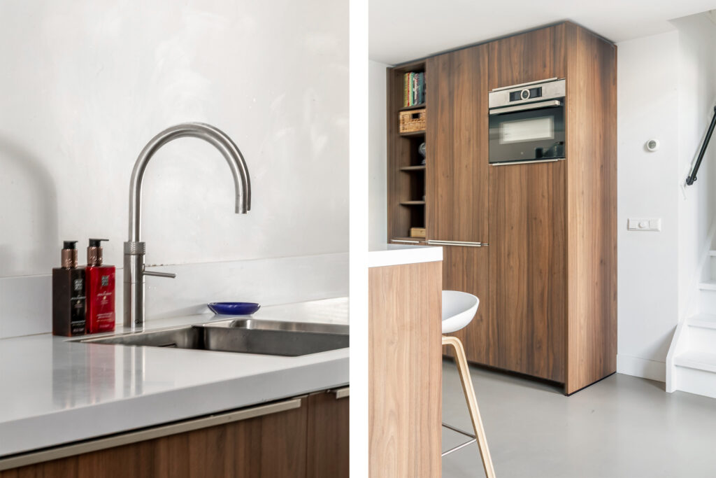 Modern kitchen with stainless steel sink and oven.