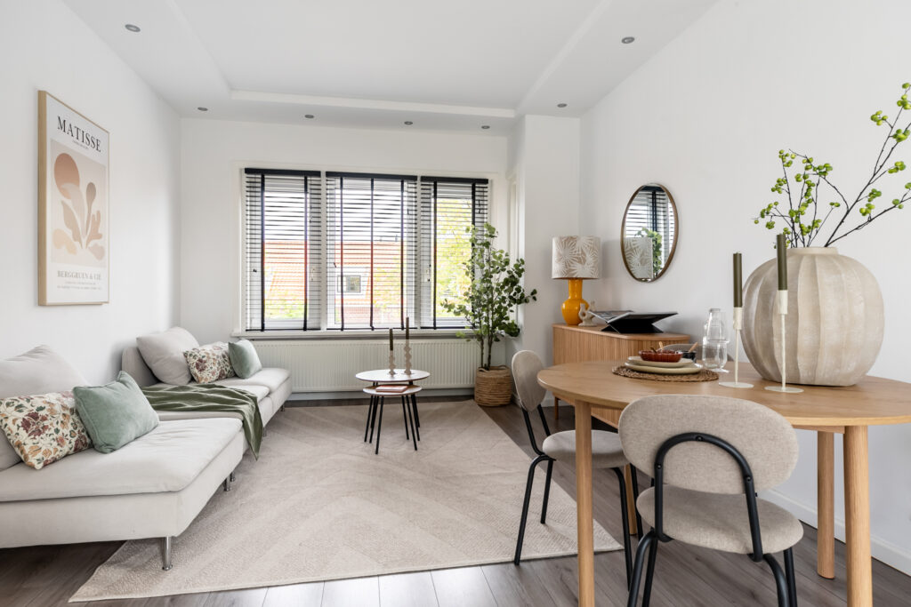 Modern living room with dining table and decor.