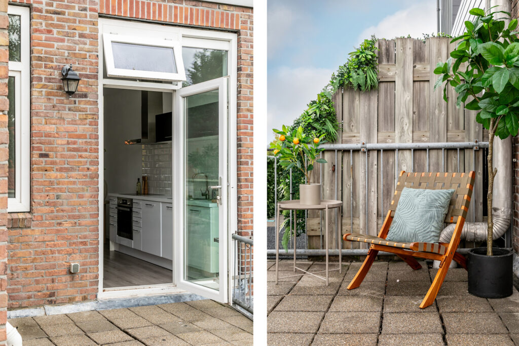 Open kitchen door leading to cozy patio with plants.