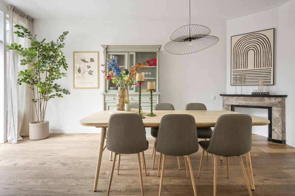 Stylish dining area with modern decor and plants.
