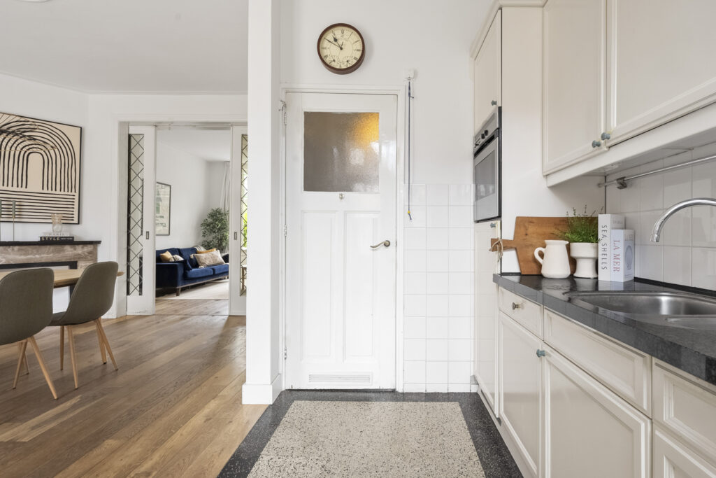Modern kitchen with view into living room