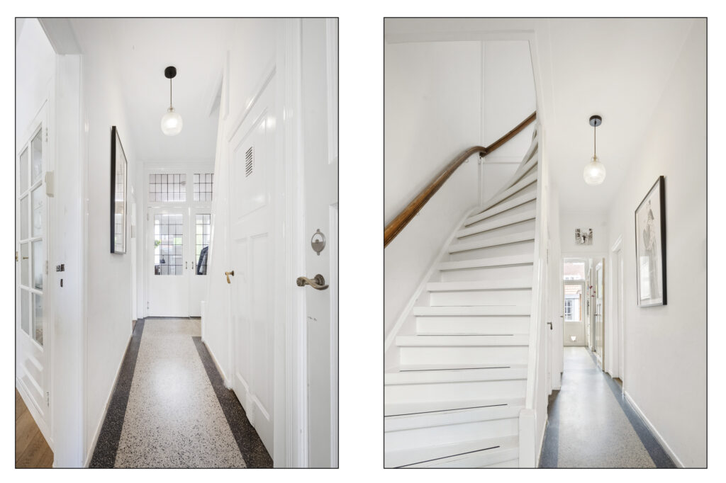Bright hallway with staircase and modern lighting