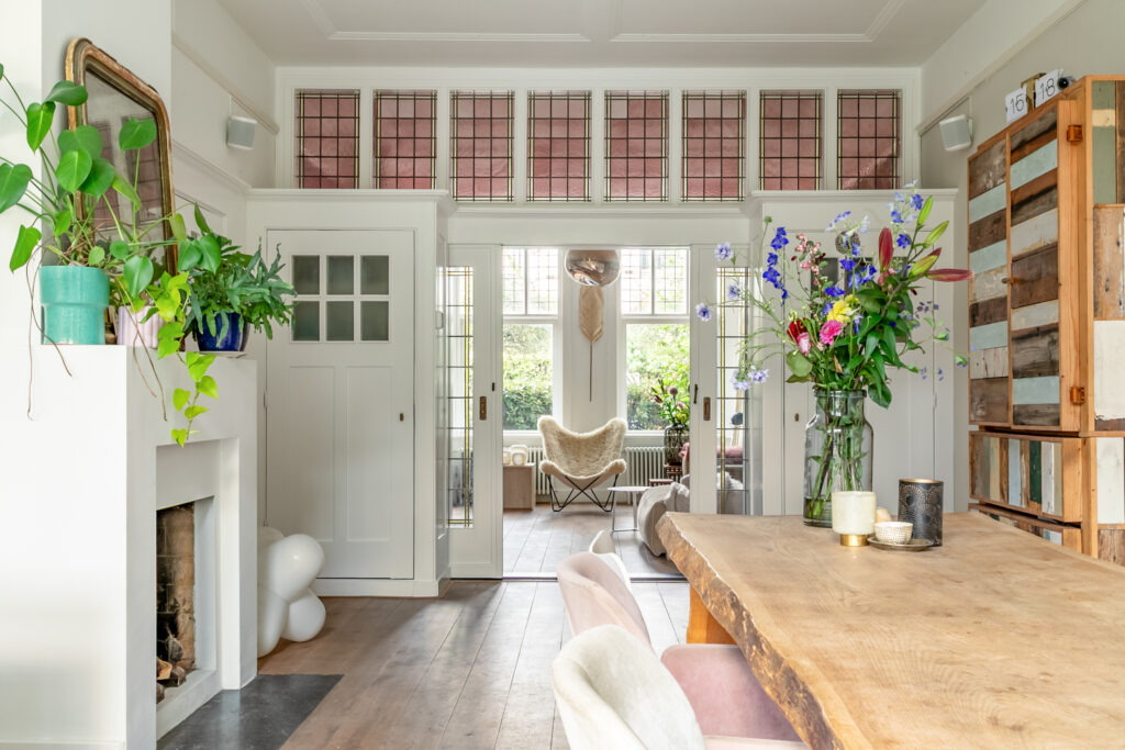 Cozy dining room with colorful floral arrangement.