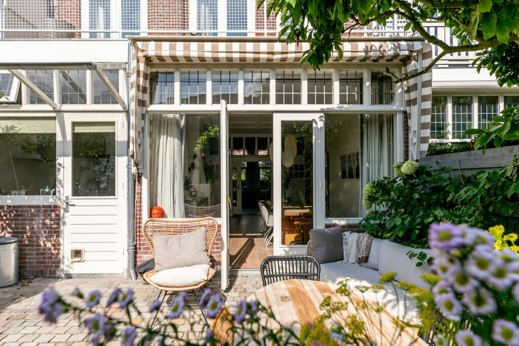 Sunny patio with plants and outdoor seating