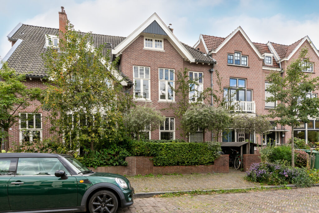 Brick houses with garden and parked car