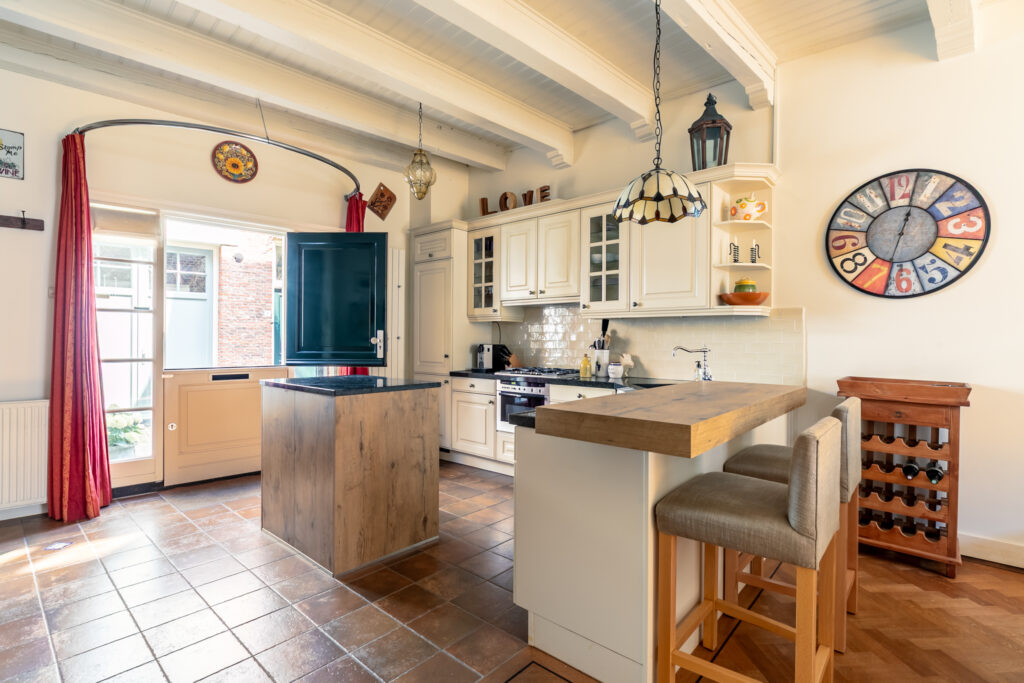 Cozy kitchen with island and vintage decor.