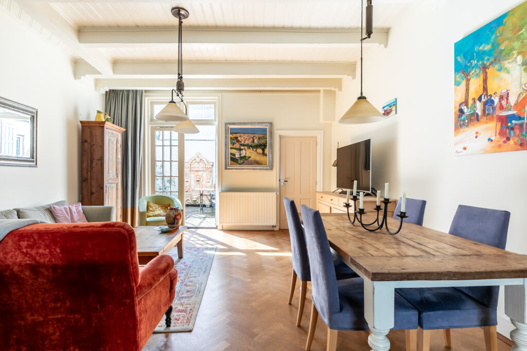 Cozy, sunlit living-dining room with modern decor.