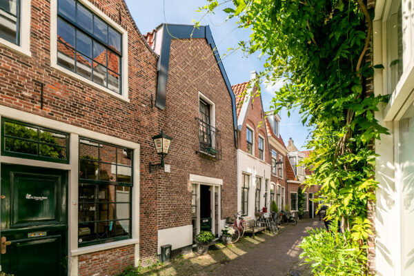 Charming narrow street with historic brick houses.