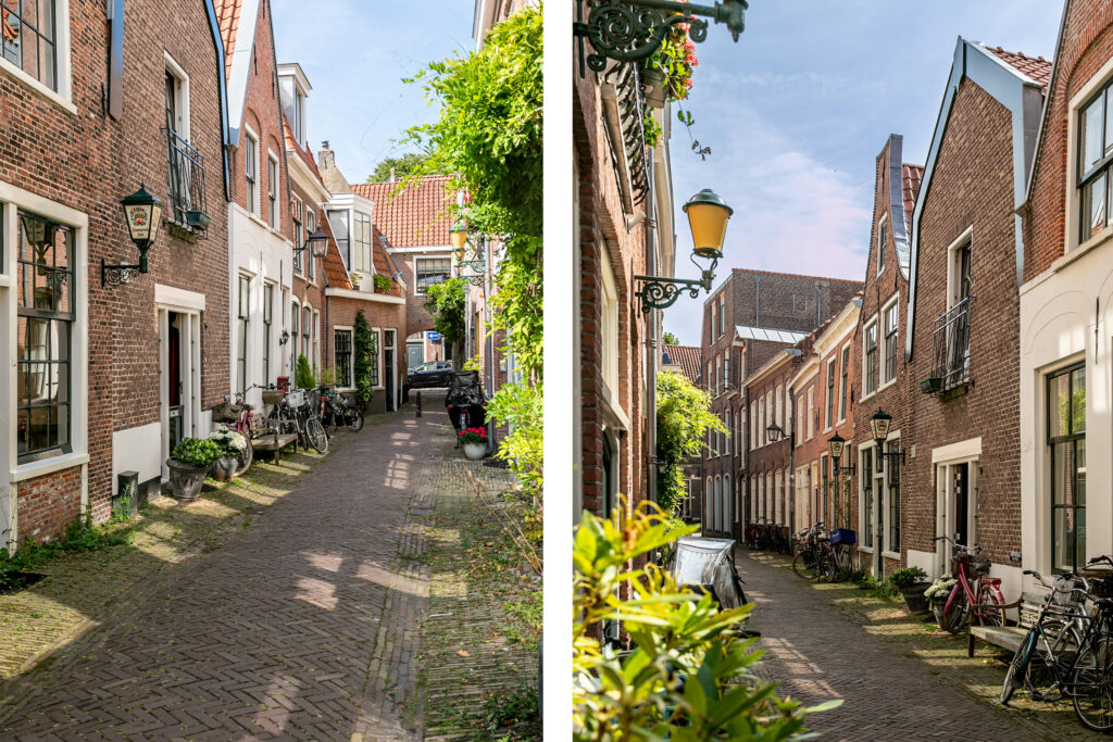 Charming narrow street with brick houses and bicycles.