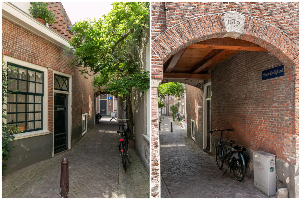 Narrow brick alleyway with bicycles and archway.