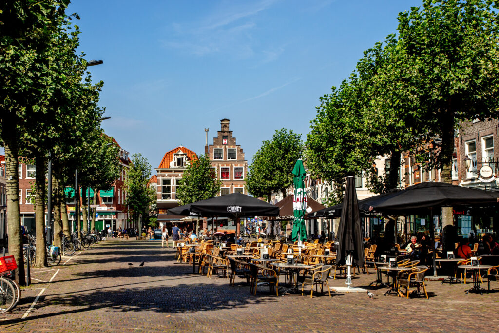 Outdoor café tables on picturesque European street.