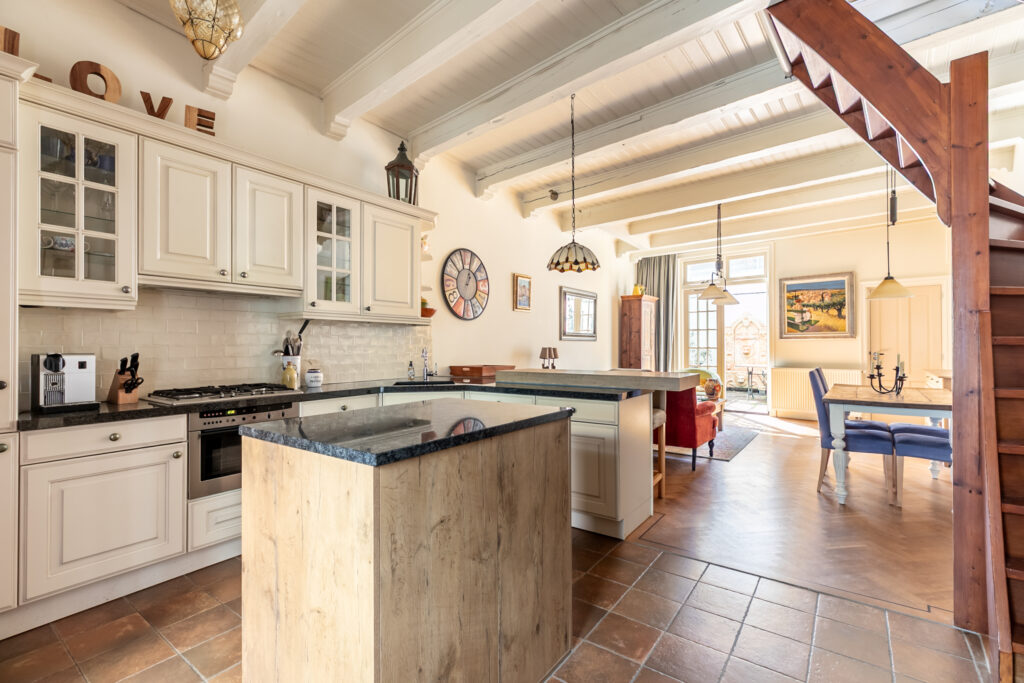 Bright open kitchen with island and dining area.