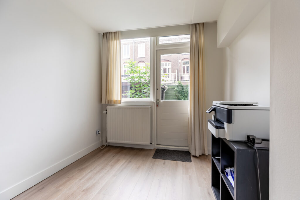 Office with printer and natural light.