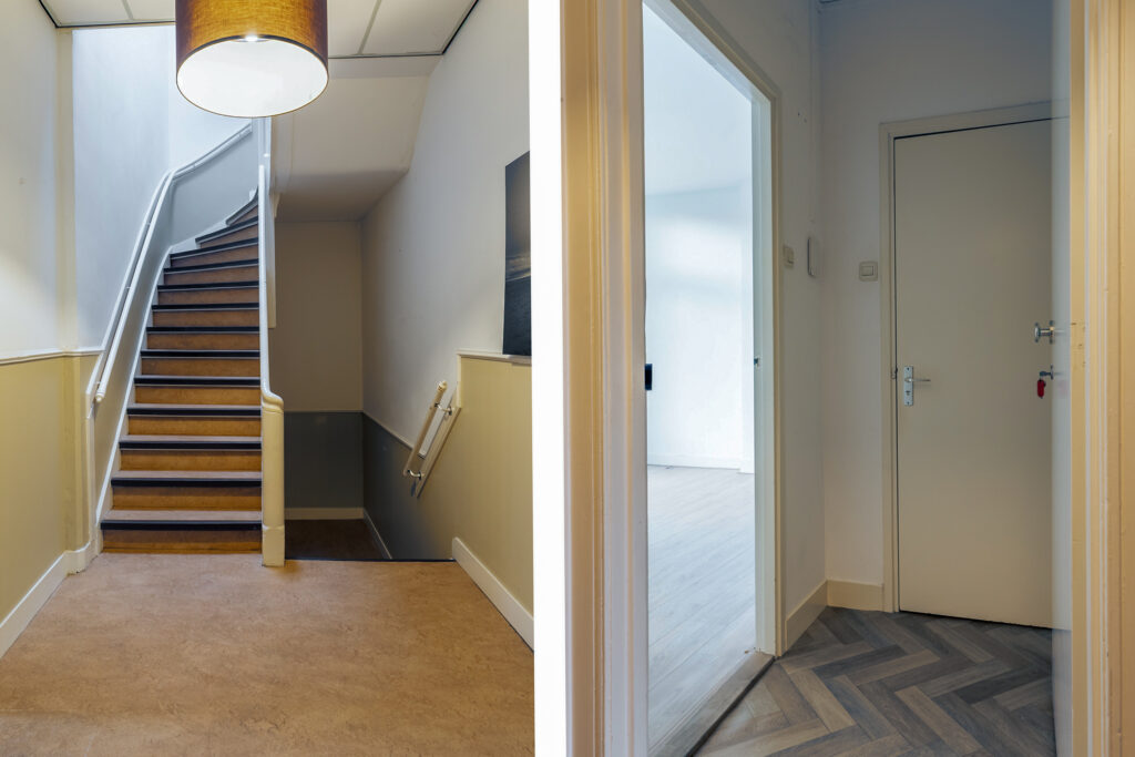 Staircase and hallway with natural lighting