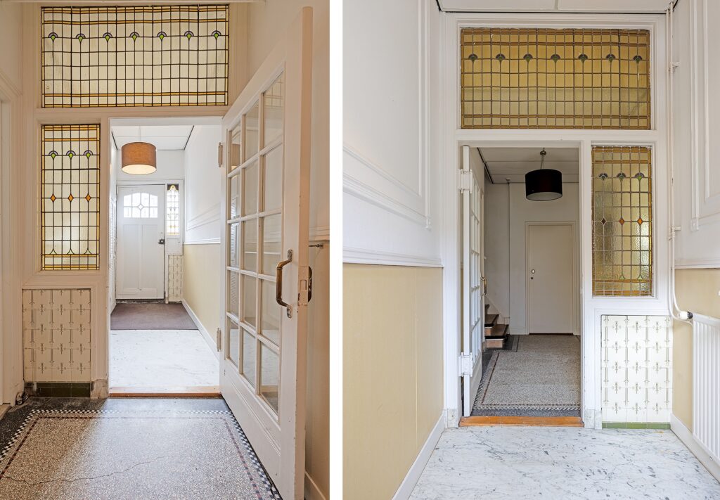Bright hallway with stained glass windows.