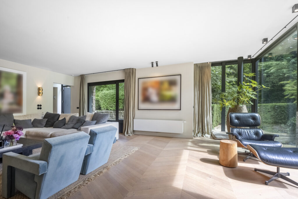 Modern living room with large windows and seating