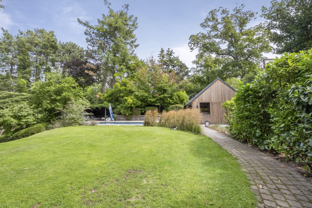 Backyard with wooden house and pool