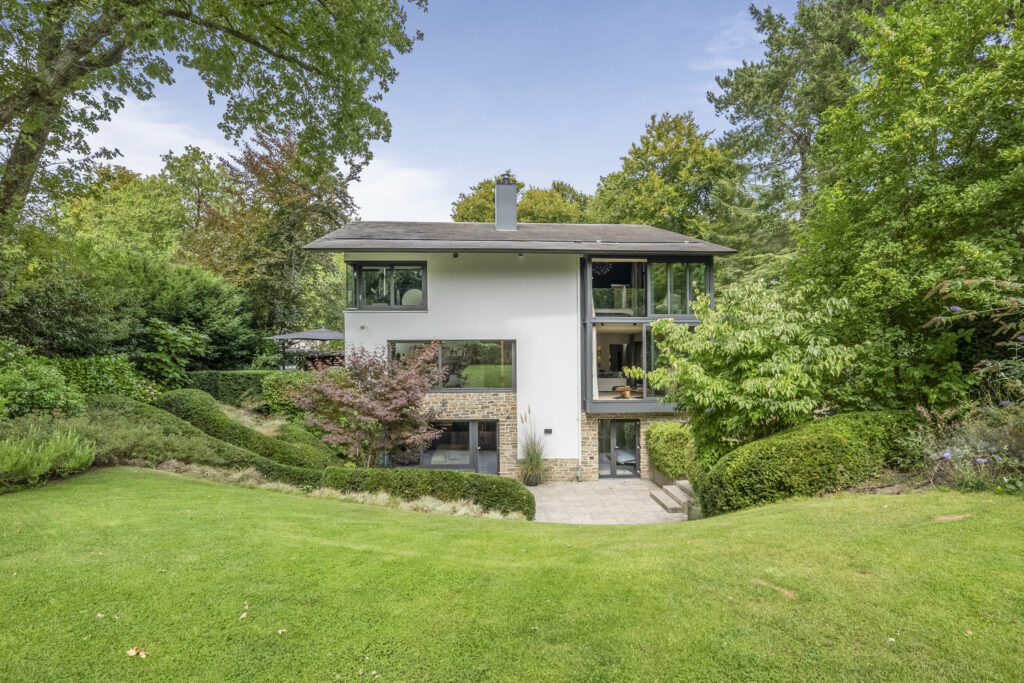 Modern house surrounded by lush greenery