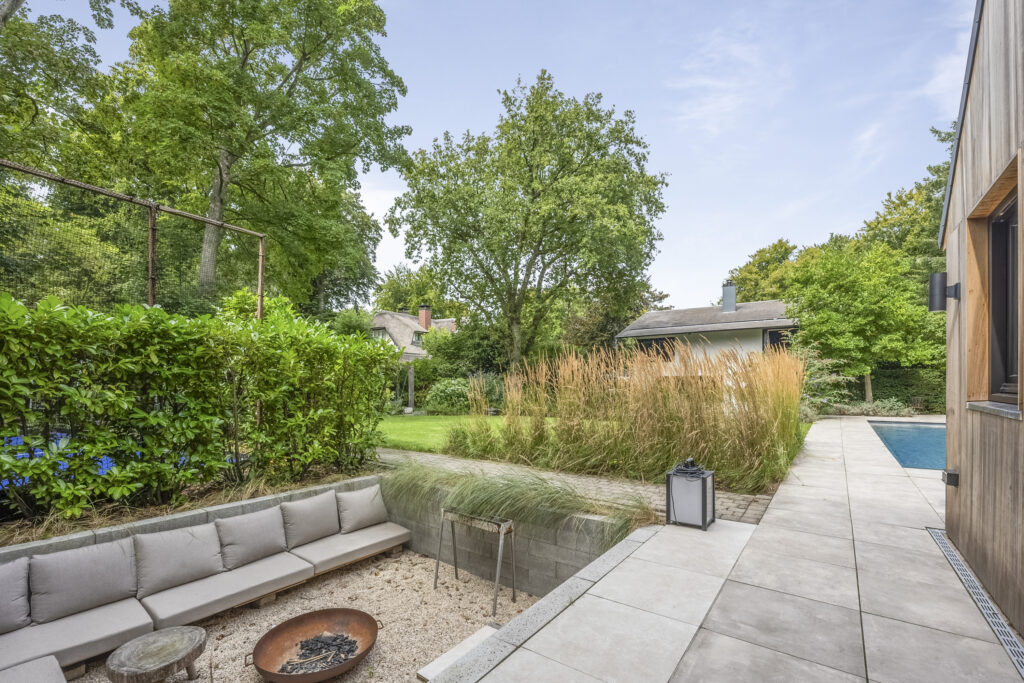 Backyard with seating, fire pit, and pool