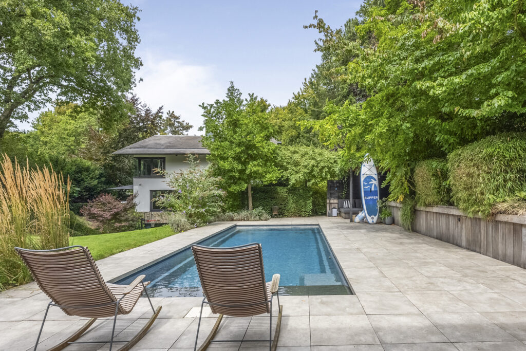Modern house with pool and lush garden