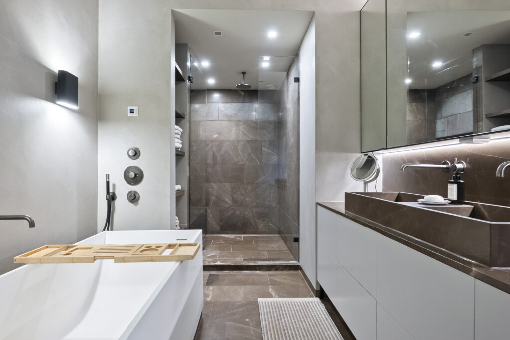Modern bathroom with tub and walk-in shower.