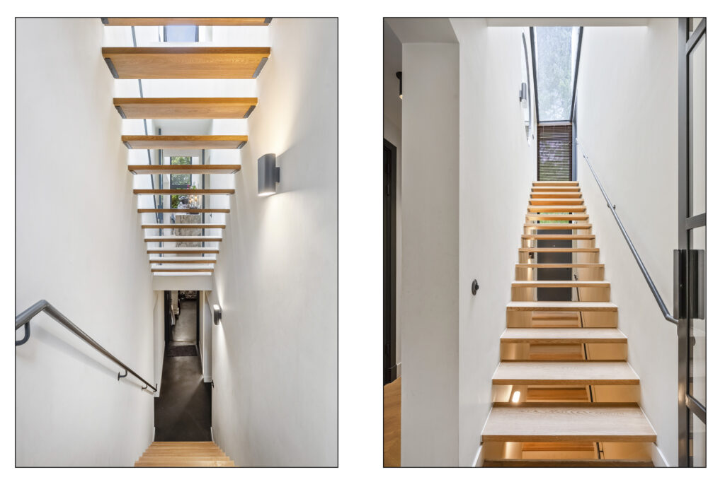 Modern wooden staircase with metal railings.