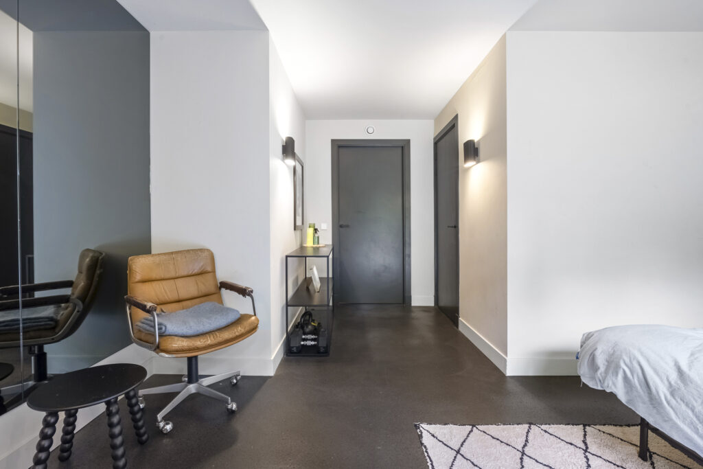Modern hallway with chair and lights