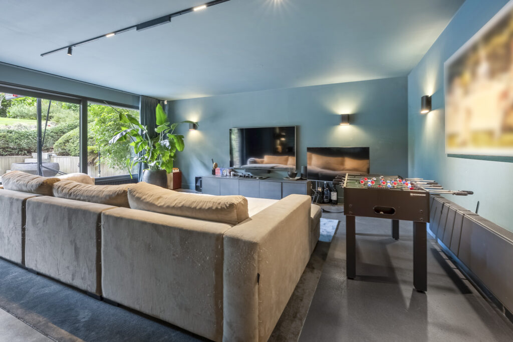 Modern living room with foosball table.