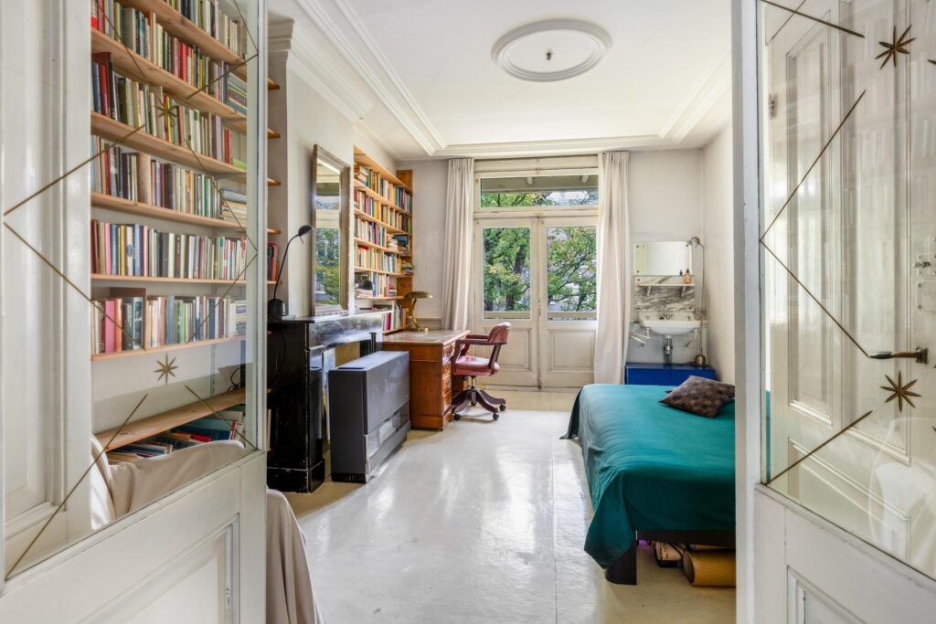 Cozy room with bookshelves and natural light.