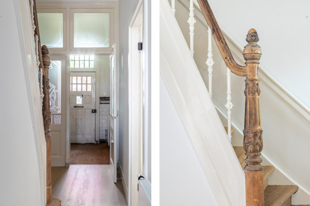 Wooden staircase and door in bright hallway