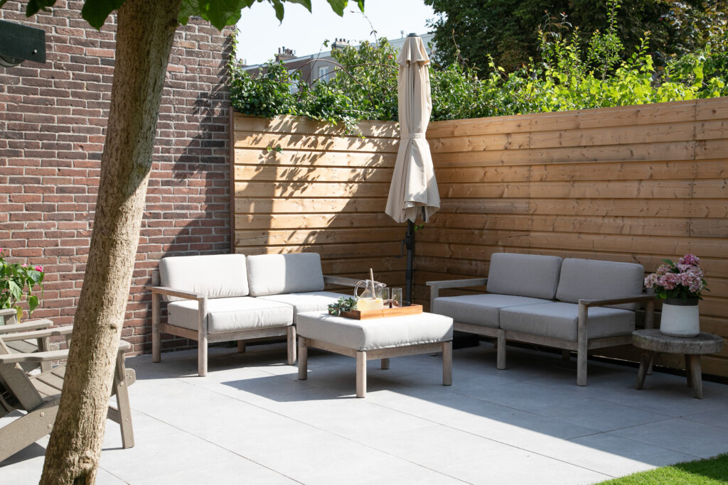 Cozy patio with outdoor seating and umbrella.