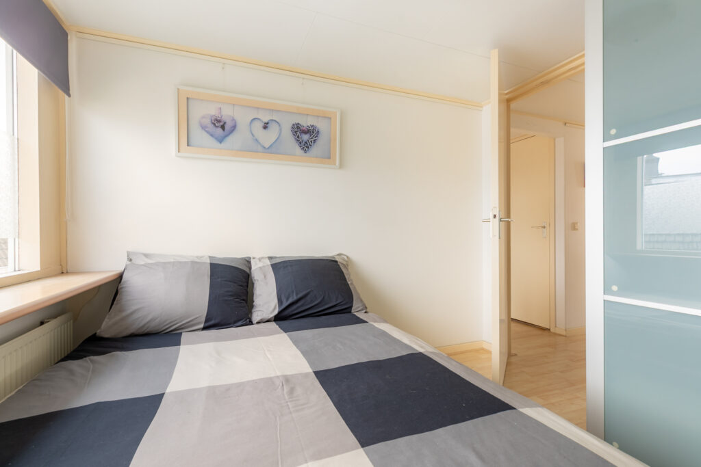 Cozy bedroom with double bed and heart decor