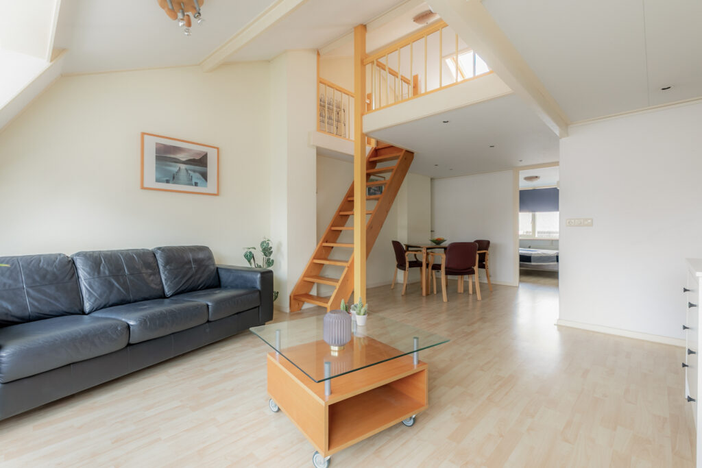 Modern living room with loft and staircase