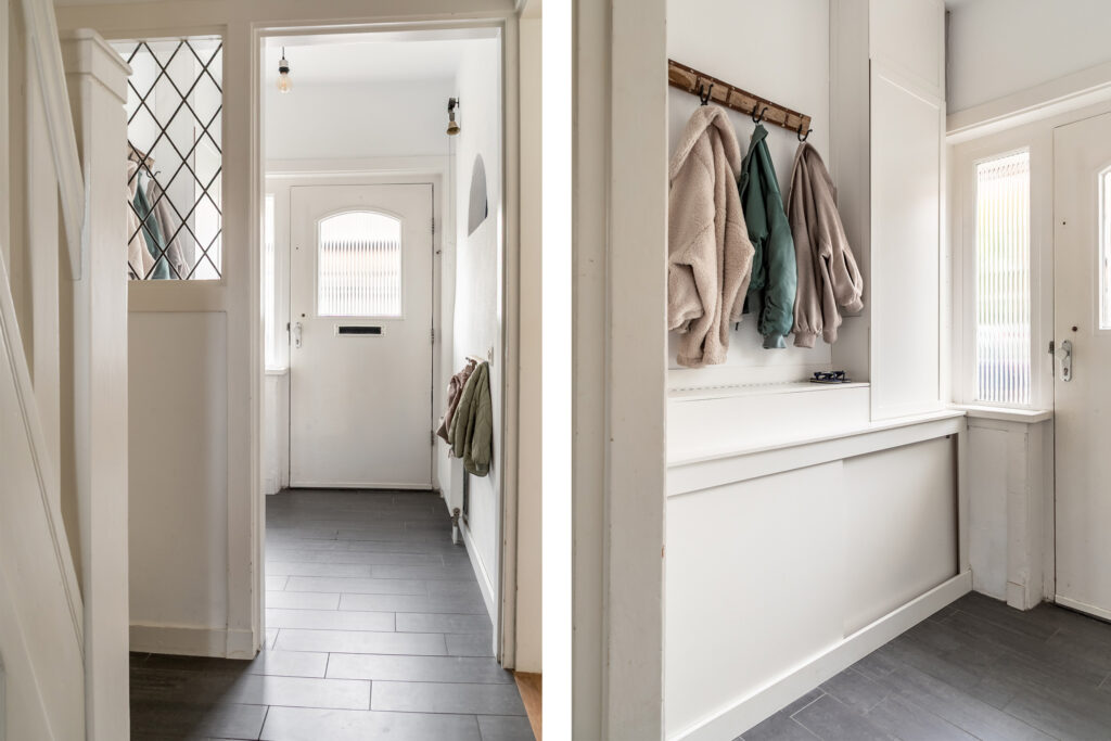 Bright entryway with coats hanging on hooks