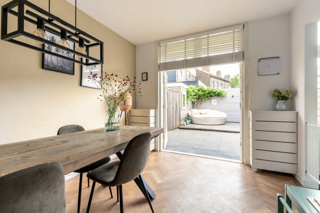 Modern dining room open to cozy patio space.