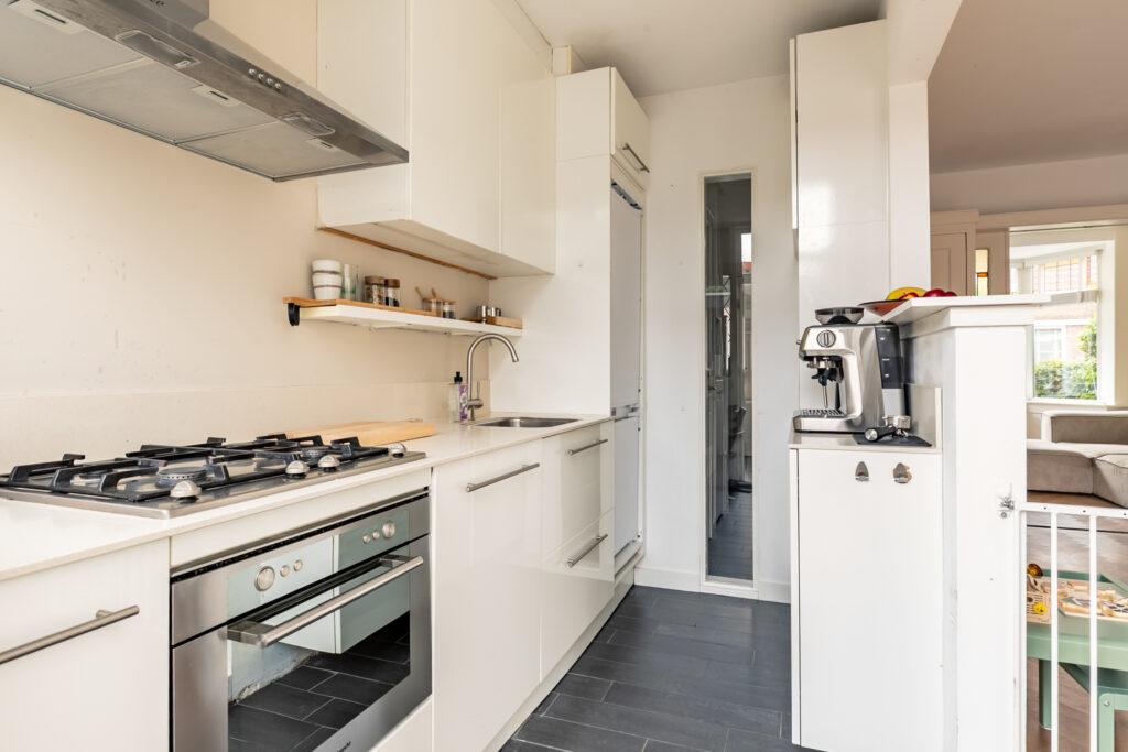 Modern kitchen with appliances and countertop space.