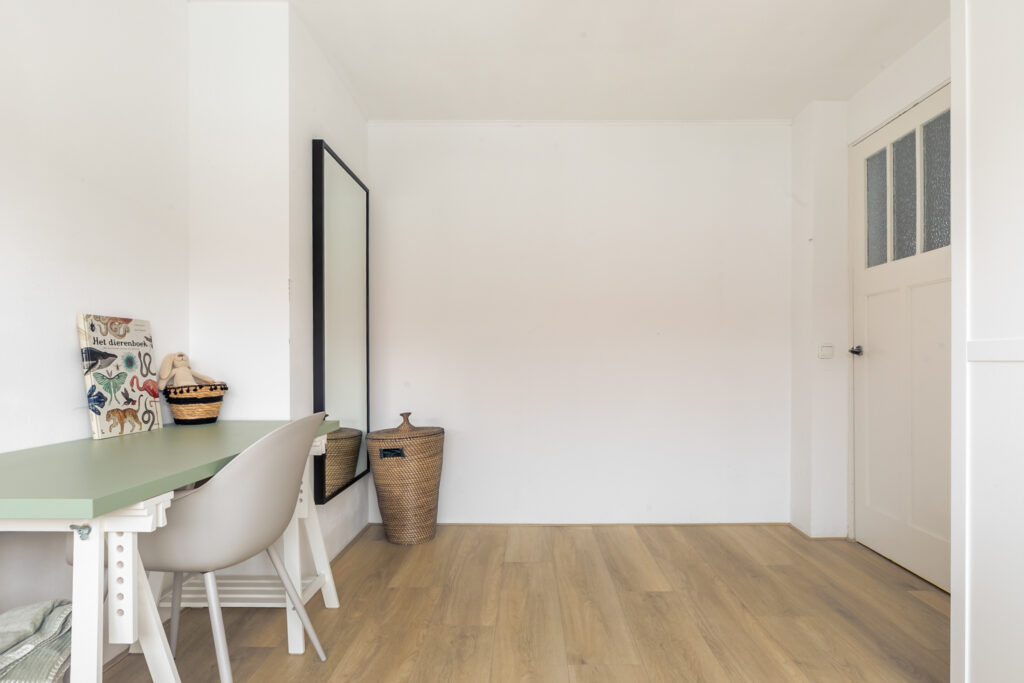 Minimalist room with a desk and chair.