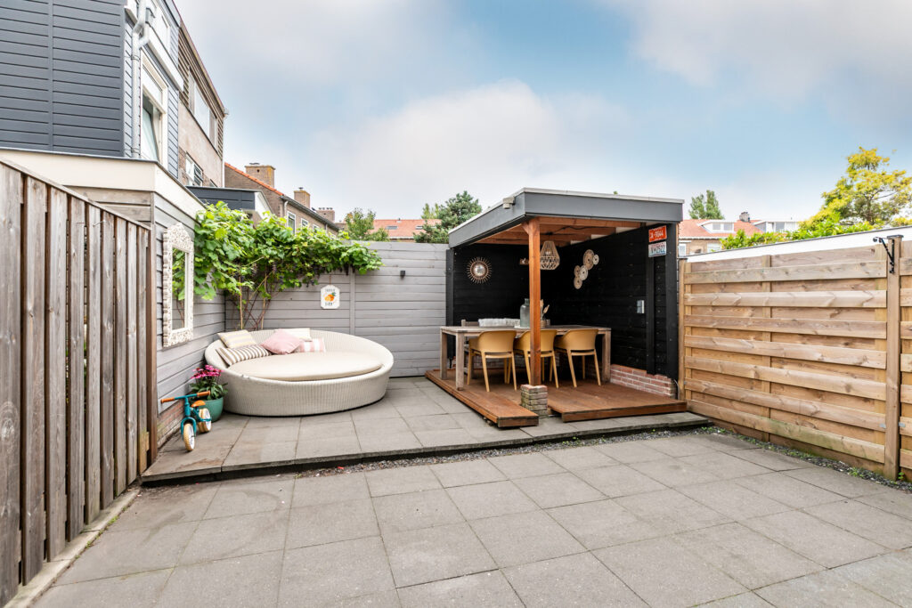 Cozy patio with seating and canopy.