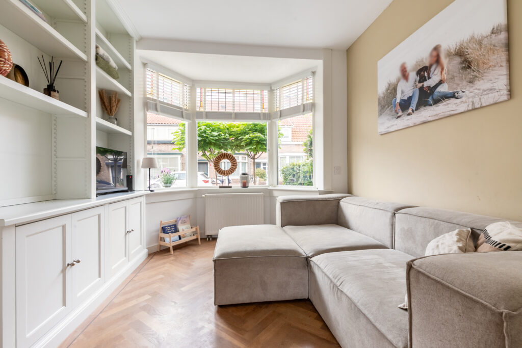 Bright living room with large couch and window