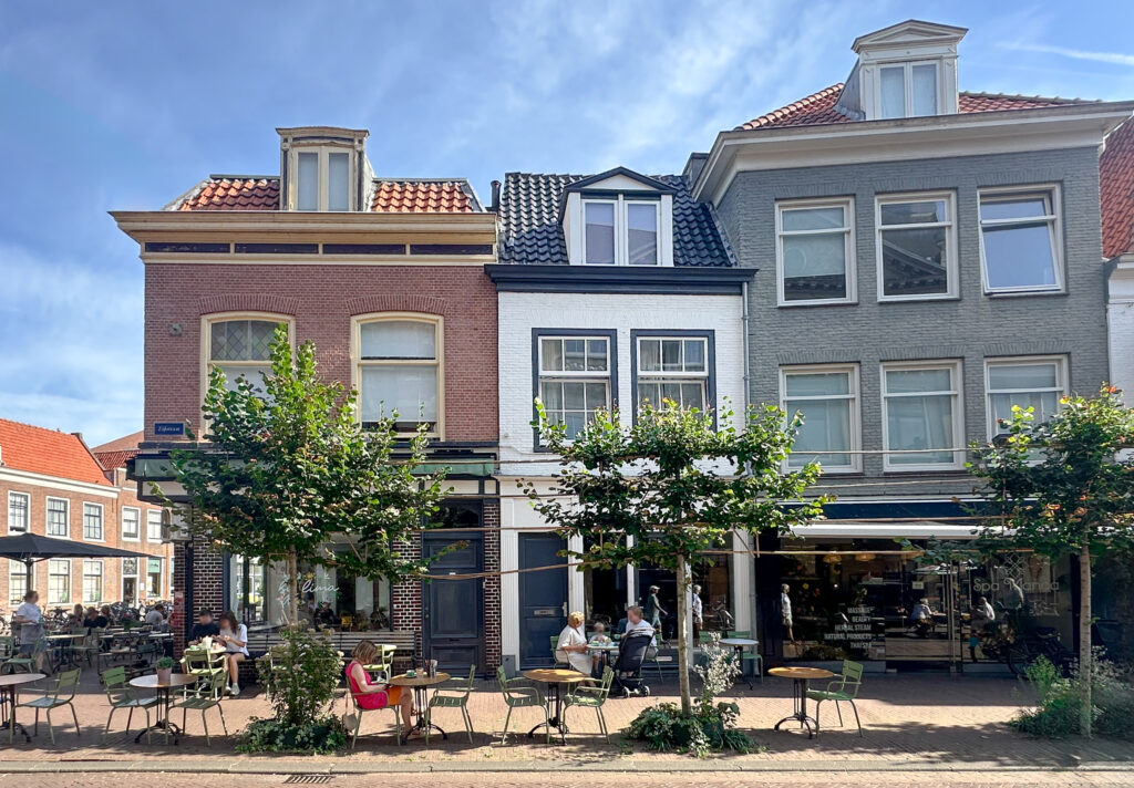 Charming European streetside cafe with outdoor seating.