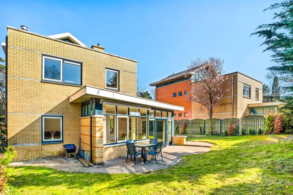 Modern house with patio and garden