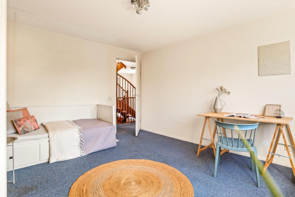 Cozy room with daybed and desk.
