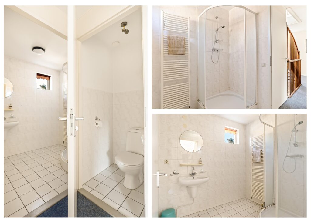 Modern bathroom with shower, toilet, and sink.