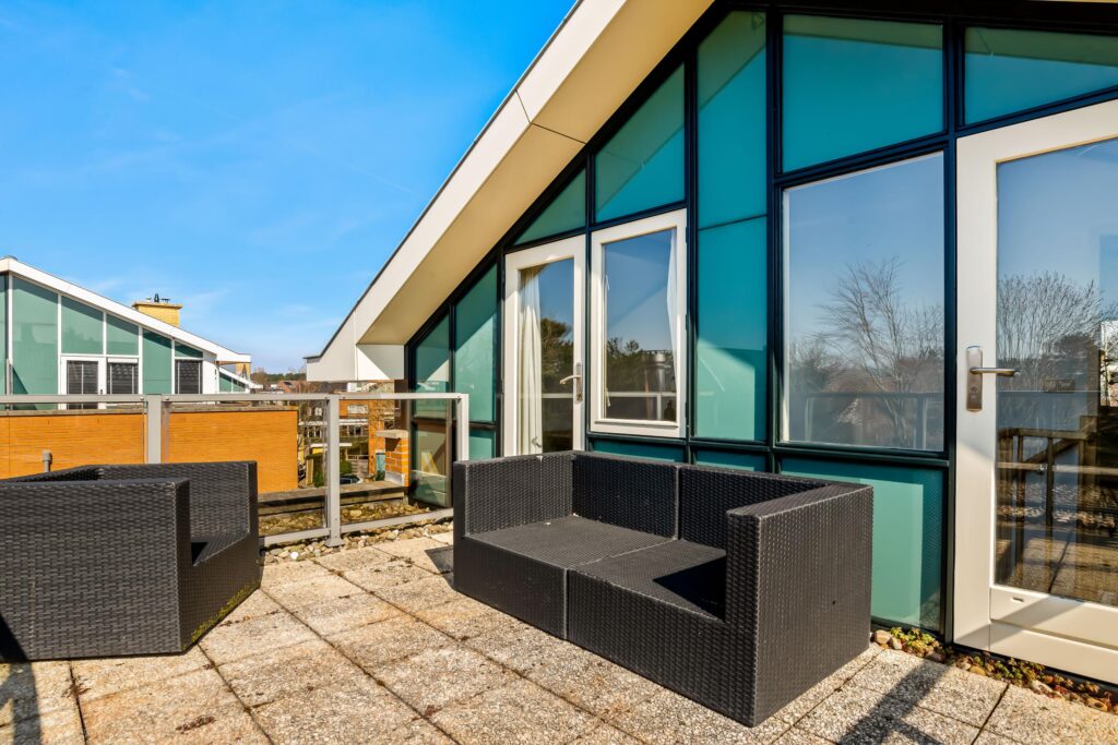 Modern rooftop terrace with black furniture