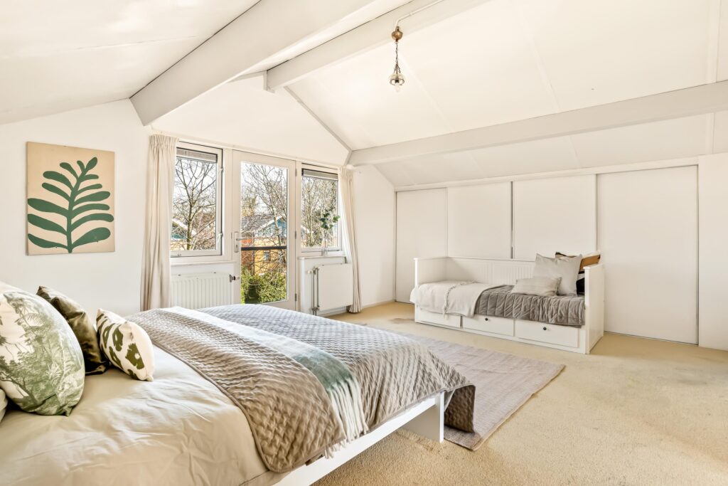 Bright bedroom with double and daybed, natural light