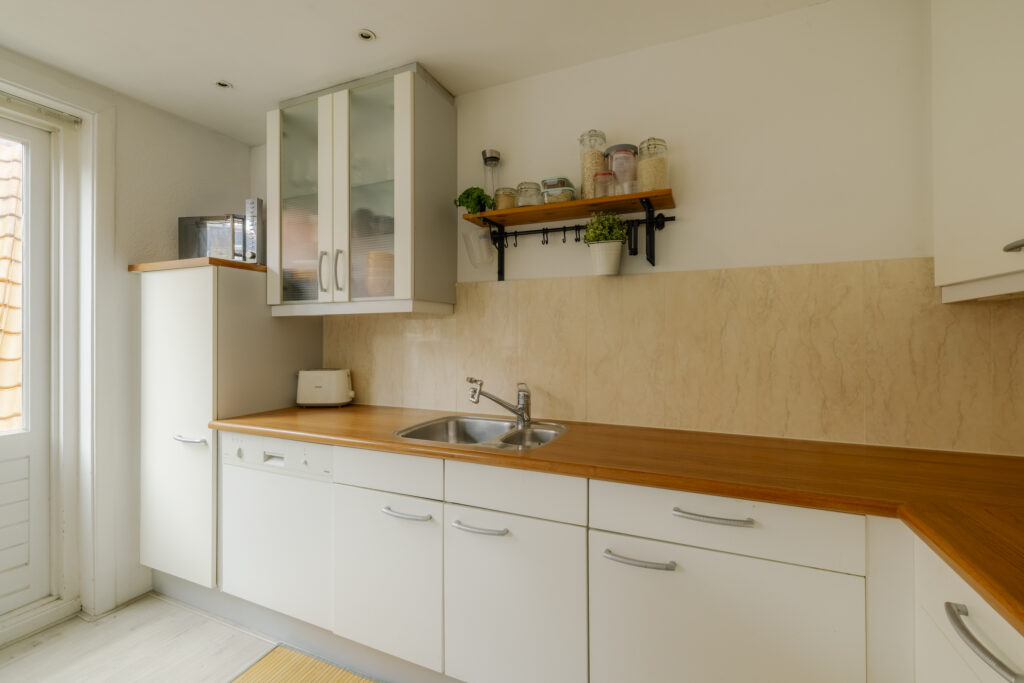 Modern kitchen with wood countertops and cabinets