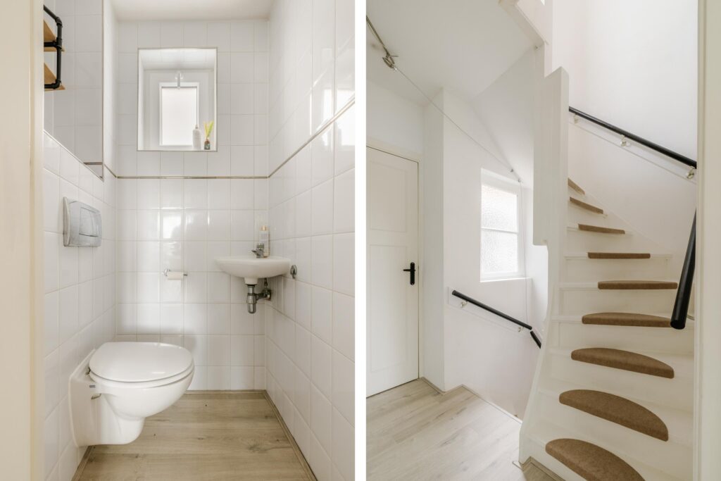 White bathroom and staircase interior design.
