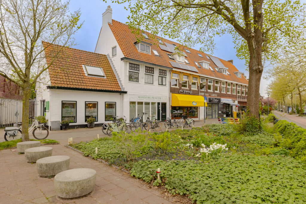 Charming Dutch street with shops and bicycles.